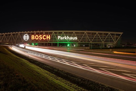 Night view of the A8 with traces of light at the P20 Messe car park, Airport, Stuttgart Germany