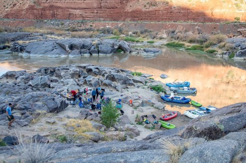 Loma, Colorado - Many children are part of a river rafting group camped in Ruby Canyon along the