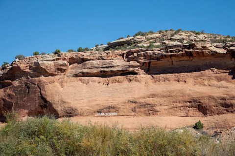 Loma, Colorado - Letters carved into the rock above the Colorado River mark the boundary between