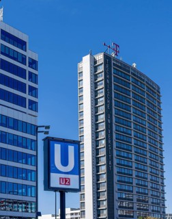Subway sign for line U2 in front of the skyscrapers at Ernst Reuter Platz, Berlin, Germany