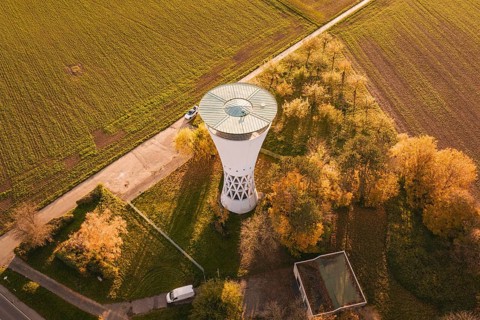 Water tower with surrounding autumn leaves, bordering fields in rural surroundings, Möglingen water