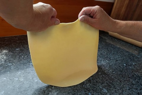 Swabian cuisine, preparing strudel dough, removing raw potato dough, countertop, baking, out of the