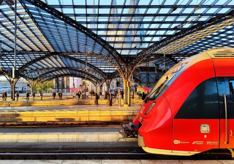 Central Station with regional express and view of the cathedral through the platform roof early in
