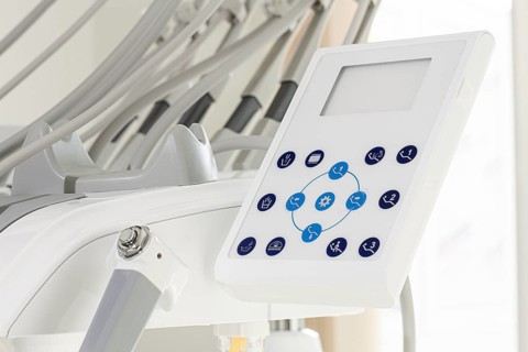 A close-up view of a dental equipment control panel showcasing various settings. This setup is
