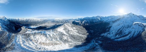 Wonderful winter landscape with Zugspitze, blue sky and snow, mountains and mountain valley, aerial