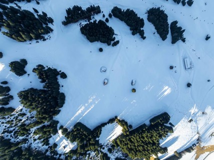 Top Down View, huts in a fantastic winter landscape, aerial view of the Wilder Kaiser ski area,