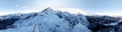 Wonderful winter landscape with Zugspitze, blue sky and snow, mountains and mountain valley, aerial