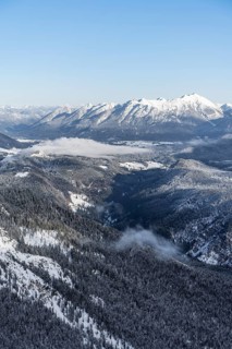View of snow-covered mountain landscape across the Reintal towards the Estergebirge and