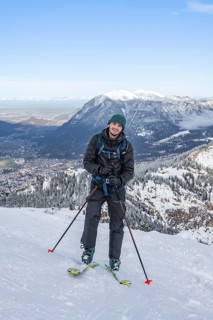 Happy ski tourer climbing to Längenfelderkopf, in winter, Wetterstein Mountains,