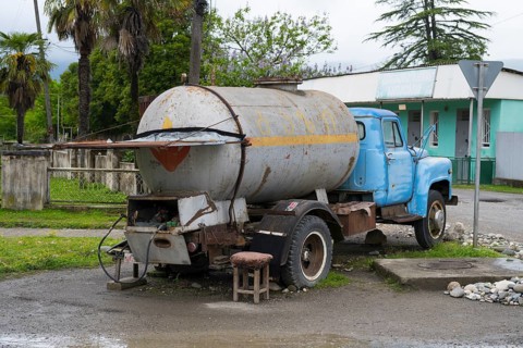 Old truck with gas tank on a rural road in rural area, gas bottles can be filled, Imereti region,