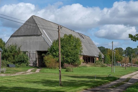 Old barn from 1921, formerly thatched, covered with asbestos panels in GDR times 1970s, Othenstorf,