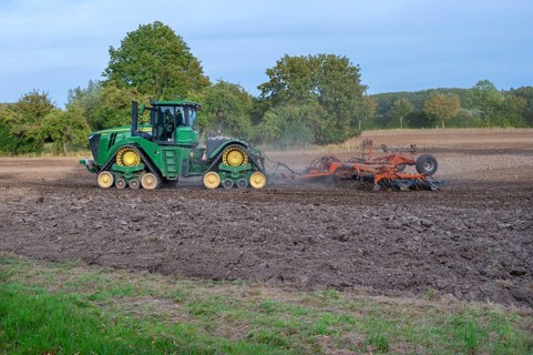 Crawler tractors harrow the field, Othenstorf, Mecklenburg-Western Pomerania, Germany