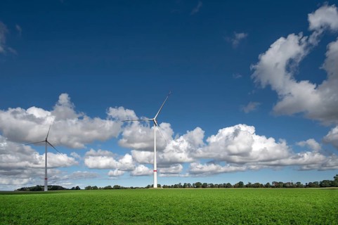 Wind turbines in a meadow, cluster clouds (Cumulus), Mecklenburg-Western Pomerania, Germany