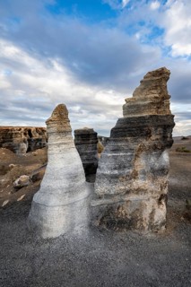 Eroded rock formations, volcanic landscape with dramatic cloudy skies, Ciudad Estratificada or Los