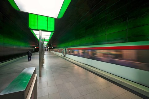 HafenCity University subway station, illuminated in color, green, underground train, movement