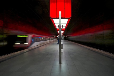 HafenCity University underground station, illuminated in color, red, underground train, movement