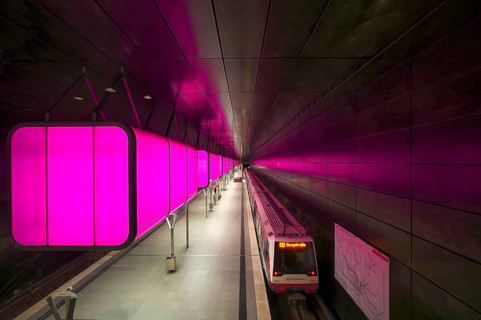 HafenCity University underground station, illuminated in color, magenta, underground train, U4,