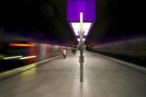 HafenCity University underground station, illuminated in color, purple, underground train, movement