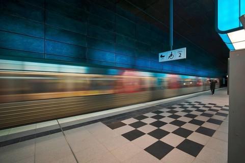 HafenCity University underground station, illuminated in color, blue, underground train, movement