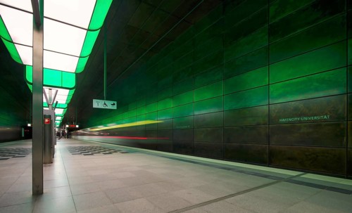 HafenCity University underground station, illuminated in color, green, underground train, motion