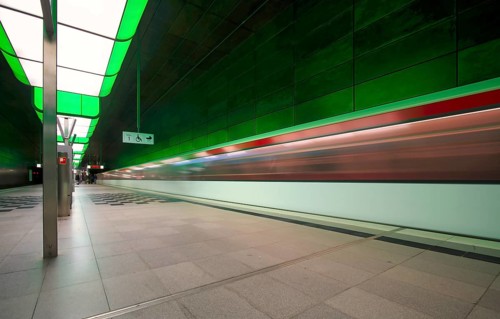 HafenCity University underground station, illuminated in color, green, underground train, movement