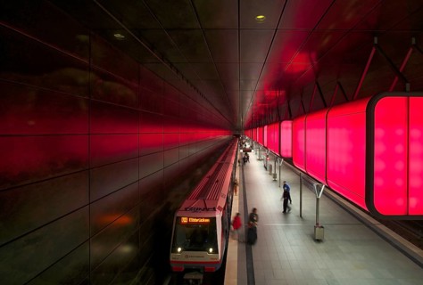 HafenCity University underground station, illuminated in color, red, underground train, U4,