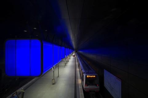 HafenCity University subway station, illuminated in color, blue, underground train, U4, travelers,