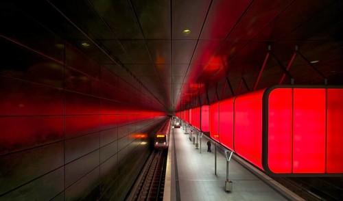 HafenCity University subway station, illuminated in color, red, underground train, movement effect,