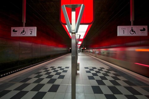 HafenCity University underground station, illuminated in color, red, underground train, movement
