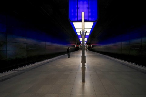 HafenCity University subway station, illuminated in color, blue, travelers, platform, stop, train