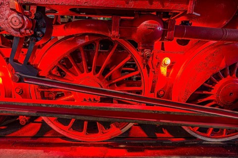 Illuminated wheelwork of a historic locomotive, railway museum, Augsburg railway park,
