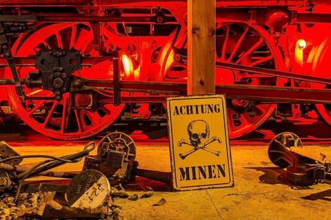 Illuminated wheelwork of a historic locomotive, replica of a mine warning, railway museum, Augsburg