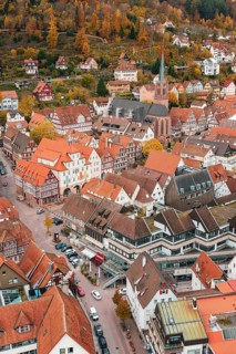 Picturesque city view in autumn with half-timbered houses and church in the middle, Calw, Black