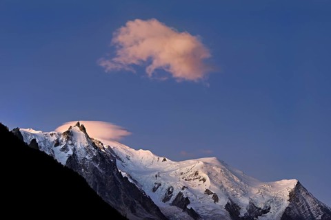 Aiguille du Midi snow-covered from left with sun-lit cloud over the summit, Mont-Blanc, Vallot Hut,