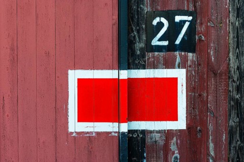 Protection signal with red and white paint at entrance gate no. 27 to the old engine shed, Augsburg