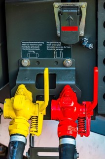Yellow and red lever for main air lines on a modern railway locomotive, Augsburg railway park,