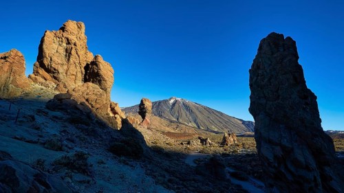 Dramatic rock formations in volcanic landscape with long shadows, UNESCO World Heritage Site, Teide