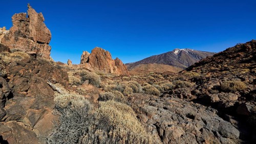 Barren landscape with rocks and volcano under bright sky, UNESCO World Heritage Site, Teide