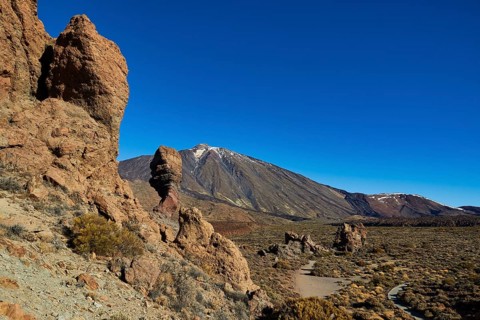 Rock formations in a dry volcanic landscape under clear sky, UNESCO World Heritage Site, Teide