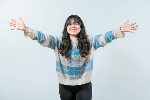 Beautiful asian woman welcoming you with open arms. Friendly asian girl welcoming with open arms