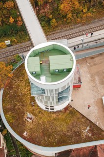 Detailed view of a tower with a green roof and walkers, Hermann Hessebahn, ZOB Calw, Germany