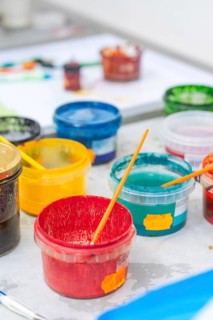 Colourful painting supplies in colorful plastic containers on a table, Christmas baking,