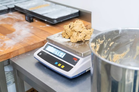 Dough on a digital scale in a kitchen, preparation for baking, Christmas baking, Haselstaller Hof,