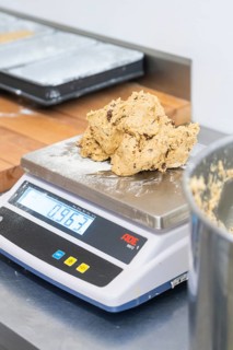 Dough ball placed on a digital scale in a kitchen, weight displayed, Christmas baking, Haselstaller