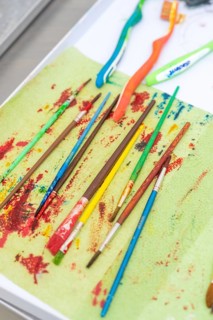 Colourful brushes and toothbrushes on a table, connected to an art project, Weihnachtsbacken,