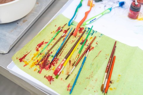Colourful brushes and toothbrushes on a creatively designed table, Christmas baking, Haselstaller