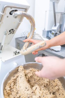 A hand grabs a mixing machine filled with dough, Christmas baking, Haselstaller Hof, Wildberg,