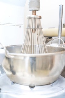 A large industrial metal mixing machine in a production kitchen, Weihnachtsbacken, Haselstaller