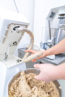 Baker works with a food processor, kneads dough in a bowl, Christmas baking, Haselstaller Hof,
