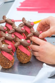 Handmade and decorated chocolate reindeer with red scarf, Christmas baking, Haselstaller Hof,